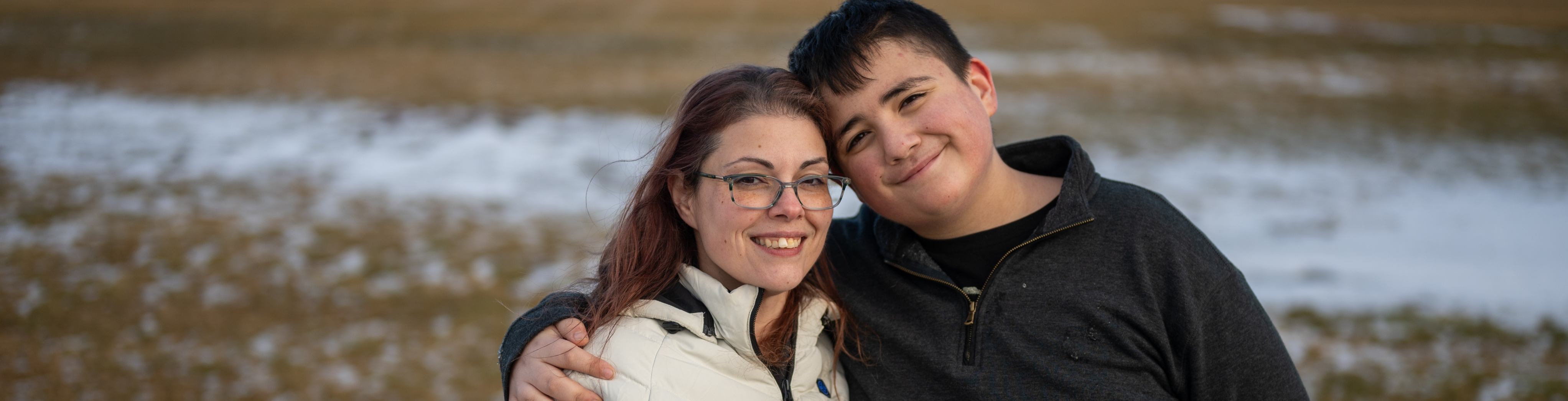 A group of volunteers give thumbs up