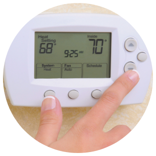 Woman Adjusting Thermostat
